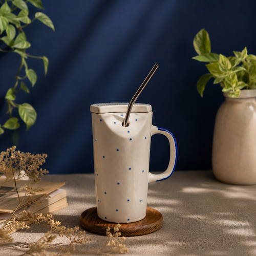 handmade blue polka dot ceramic sipper mug with steel straw and lid