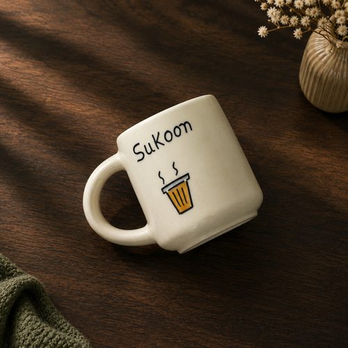 Handpainted ceramic mug with "Sukoon" text and chai glass illustration
